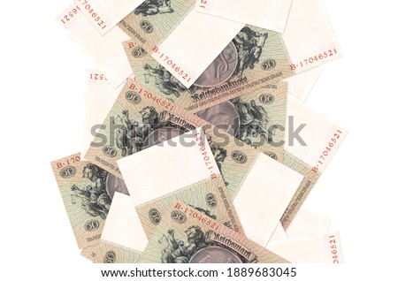 50 Reich marks bills flying down isolated on white. Many banknotes falling with white copy space on left and right side