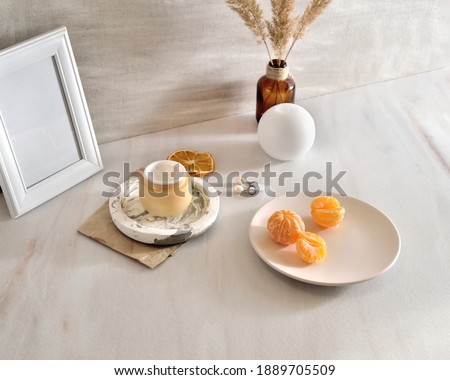 Beauty life style background with Opened Jar of face cream and fresh tangerines. sample natural organic cosmetic with vitamin C concept. Selective Focus
