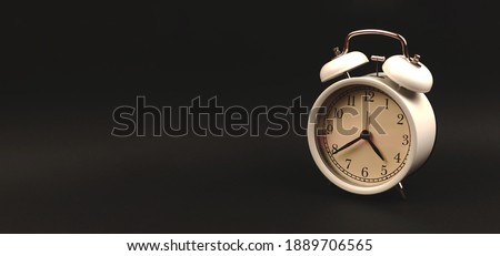Vintage alarm clock on a black background banner, copy space photo