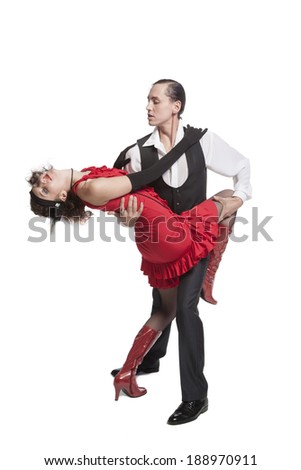 young couple dancing tango in retro costumes on white background