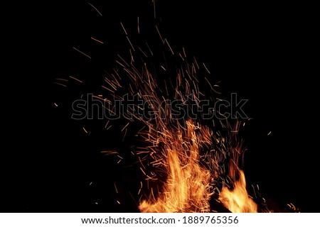 Flames Of Fire And Sparks Isolated On Black Background. Abstract Flaming Background. Magic Fiery Wallpaper. Flying Sparks Background,  Closeup View. Bonfire Flaming In The Night. Energy Concept. Royalty-Free Stock Photo #1889765356