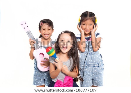 Little asian girls singing a song isolate on white background Royalty-Free Stock Photo #188977109