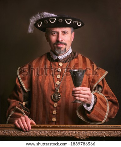 Medieval portrait of man in king costume.  Royalty-Free Stock Photo #1889786566