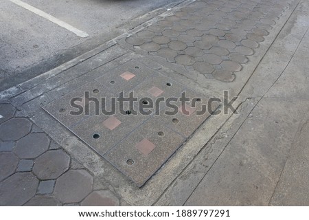 Concrete pavement and sewer cover