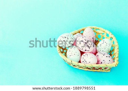 bright easter eggs on a blue plain surface, easter decor, close-up