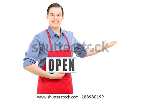 Man with apron holding an open sign isolated on white background