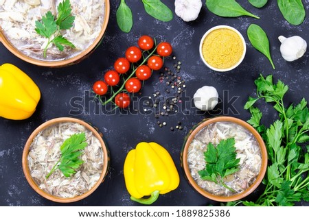 Food.Aspic and fresh vegetables. Headcheese.The national dish of Russian, Ukraine and Belarus. .Jelly. Tomatoes and parsley.Jellied minced meat. Flat lay.