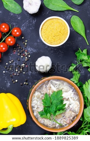 Food.Aspic and fresh vegetables. Headcheese.The national dish of Russian, Ukraine and Belarus. .Jelly. Tomatoes and parsley.Jellied minced meat. Flat lay. Vertical orientation.