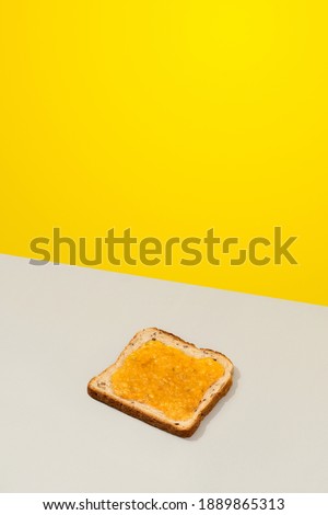 Delicious toast with lemon jam on gray background