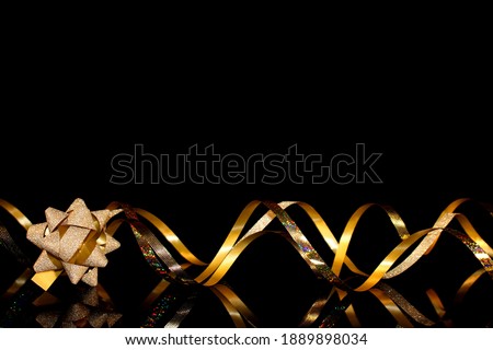 beautiful festive background, golden serpentine on a black background