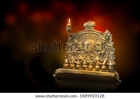 Menorah, Hanukkiya, Jewish candelabra for December Chanukah celebration. The Hebrew characters in the center are the numbers 1 through 10, standing for the ten commandments.