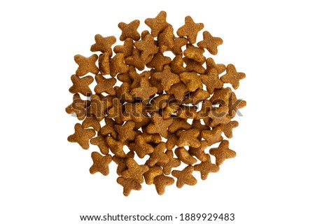 Dry food for dogs and cats pile top view isolated on white background