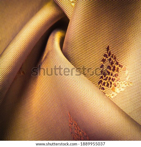 silk fabric, color brown, delicate pattern, pattern in the form of a combination of lines, shadows. texture background. template. chocolate