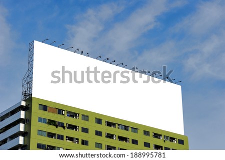 Blank billboard mounted on buildings for advertising purposes.