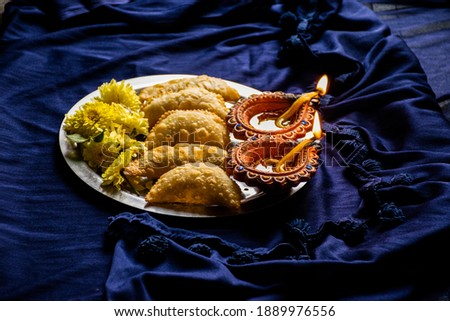 Picture of delicious traditional Indian sweet dish karnaji or ghujia or ghughara.