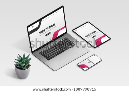 Web design studio promo page on laptop, tablet and phone display concept. Isometric view of desk with plant decoration Royalty-Free Stock Photo #1889998915