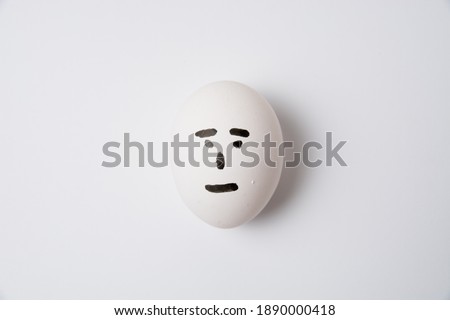An egg with an indifferent emotion on the face, on a white background copy space