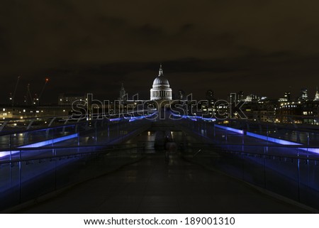St. Paul's Cathedral and the Millenium bridge at night in London, United Kingdom.