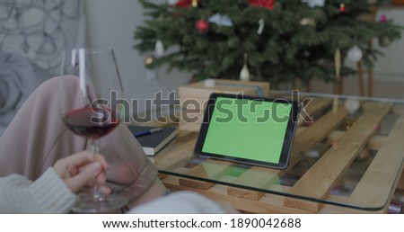 Female having glass of wine while chatting