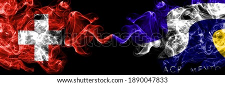 Switzerland, Swiss vs United States of America, America, US, USA, American, Sacramento, California smoky mystic flags placed side by side. Thick colored silky abstract smoke flags.
