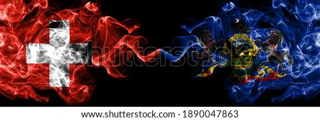 Switzerland, Swiss vs United States of America, America, US, USA, American, Pennsylvania smoky mystic flags placed side by side. Thick colored silky abstract smoke flags.