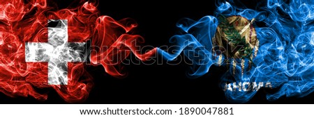 Switzerland, Swiss vs United States of America, America, US, USA, American, Oklahoma smoky mystic flags placed side by side. Thick colored silky abstract smoke flags.
