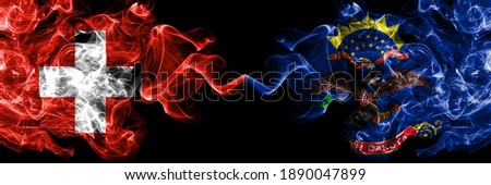 Switzerland, Swiss vs United States of America, America, US, USA, American, North Dakota smoky mystic flags placed side by side. Thick colored silky abstract smoke flags.