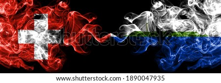 Switzerland, Swiss vs United States of America, America, US, USA, American, Navassa Island smoky mystic flags placed side by side. Thick colored silky abstract smoke flags.