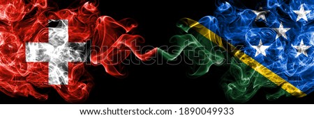 Switzerland, Swiss vs Solomon Islands smoky mystic flags placed side by side. Thick colored silky abstract smoke flags.