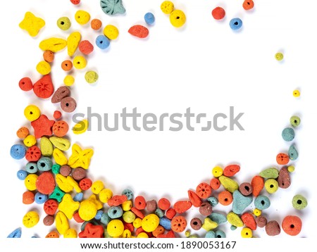 Frame made of multicolored plasticine balls isolated on a white background. Decorative elements of various sizes and colors. Round figures for children's creativity. Free space for the label