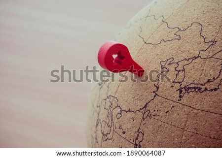 Close up red mark pin pointing on globe at China map background copy space. China is business and finance hub center in Asia. World map, globe location, gps, worldwide travel concept. Royalty-Free Stock Photo #1890064087