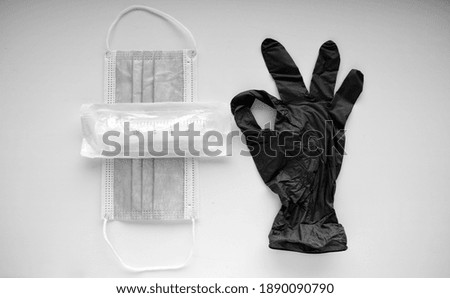 a medical glove that shows that everything is fine, an OK sign and a medical mask with a syringe, a required set in 2021, stop covid-19