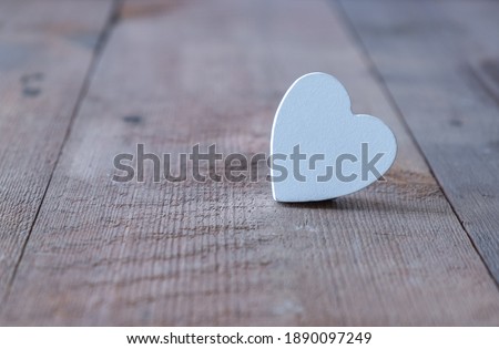 Valentines day background. Heart on a wooden table in rustic style. 