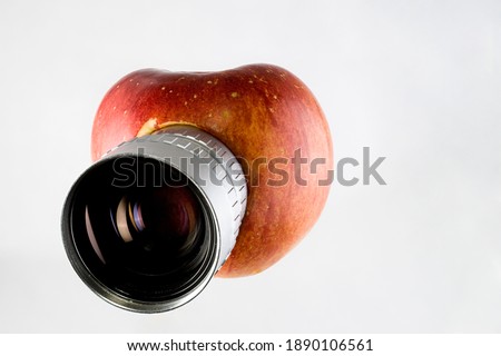 Apple fruit with camera lens, isolated, parody, creative concept