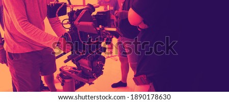 Video production and studio set up for movie shooting. Behind the scenes of filming online video production with professional 8k camera equipment and film crew team working. movie industry concept.