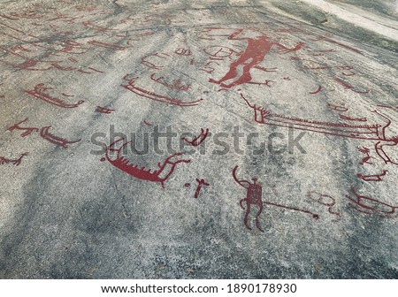 Nordic mythology and history. Runic script on stone. Tanum Sweden. Royalty-Free Stock Photo #1890178930