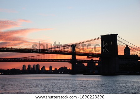 Brooklyn Bridge and Manhattan Bridge over the east river at breaking dawn. Just before sunrise.