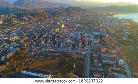 Republican Stadium Sochumi. resort town Sukhum, Abkhazia aerial view from drone. Suburb or outskirts of the city. Private sector or cottage development.