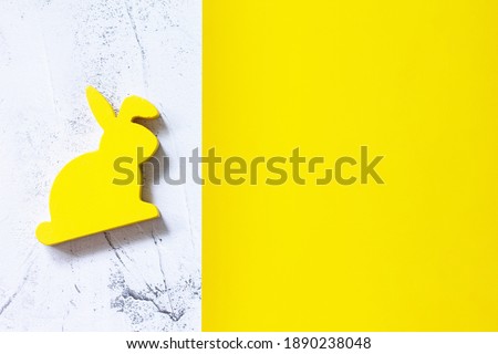 Minimal the Easter rabbits on Illuminating Yellow and Ultimate Gray Color of the year 2021. Top view flat lay background. Copy space.