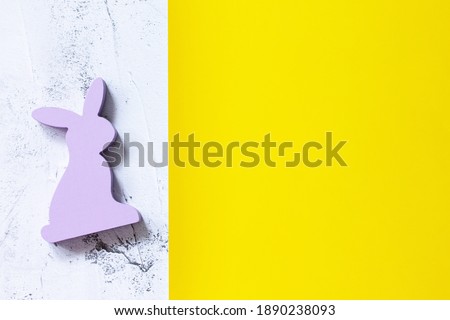 Minimal the Easter rabbit on Illuminating Yellow and Ultimate Gray Color of the year 2021. Top view flat lay background. Copy space.