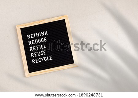 Rethink, reduce, refill, reuse, recycle. Black letter box with eco friendly motivational quote. Zero waste sustainable lifestyle. Plastic free concept. Flatlay, top view, copy space