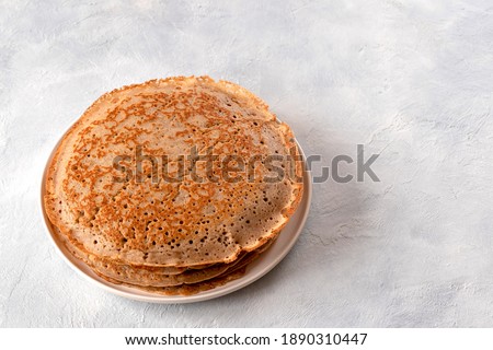French pancakes made from buckwheat flour for breakfast. Royalty-Free Stock Photo #1890310447