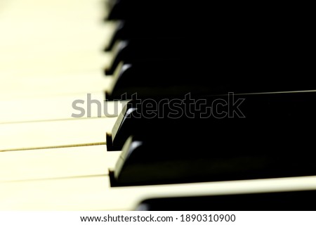 Piano keys from an old acoustic piano - close up - selective focus
