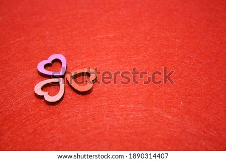 Valentine's day background with wooden heart. Red background.