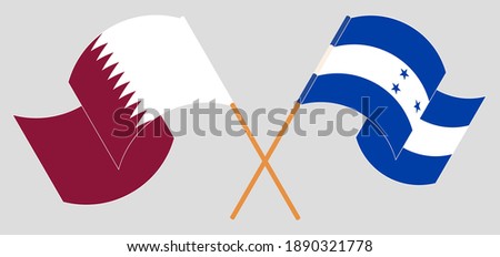 Crossed and waving flags of Qatar and Honduras