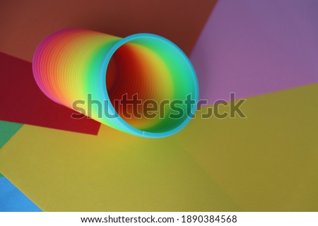 Plastic magic spring colourful toy rainbow colours, photography with blank space for your own text