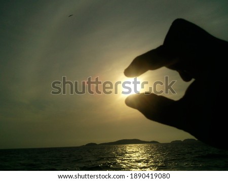 Touching the sun on the beach