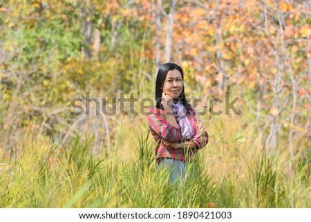 Beautiful women posing for pictures in the forest.