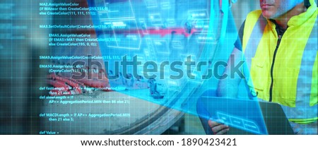 Engineer working in factory with laptop computer futuristic GUI graphic user interface technology sci fi background, smart factory innovation industry