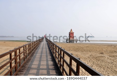 lighthouse at the beach of lignano, italy